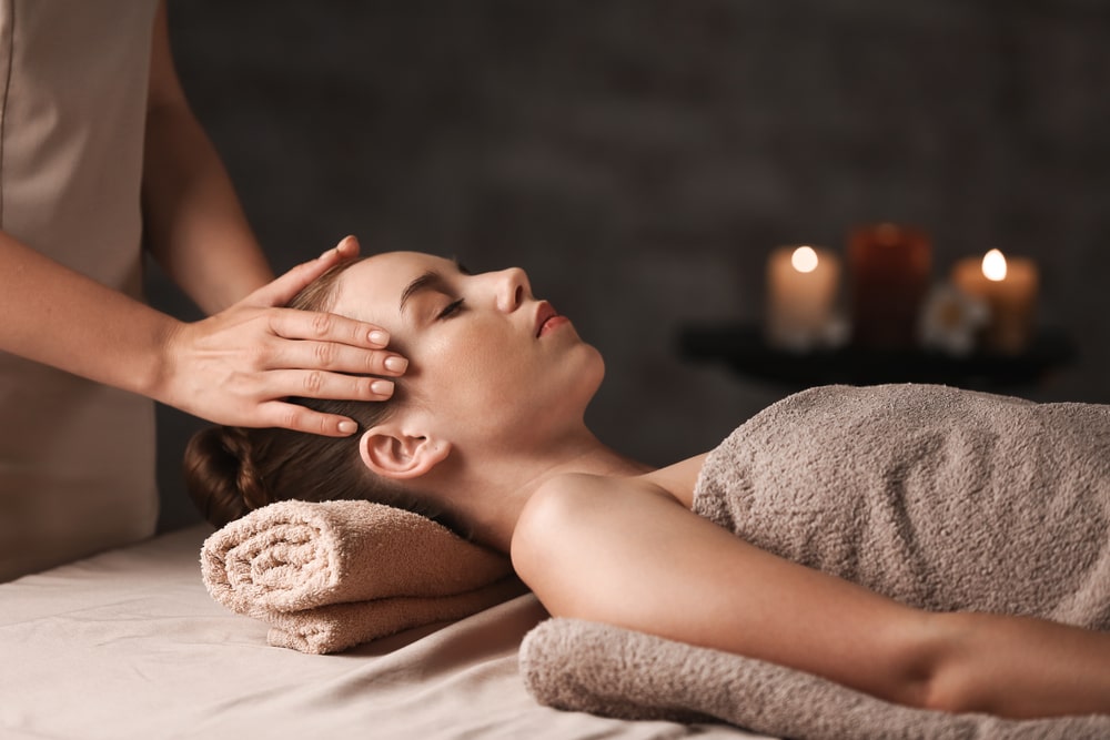 Lady taking Relaxation Massage Therapy in Calgary